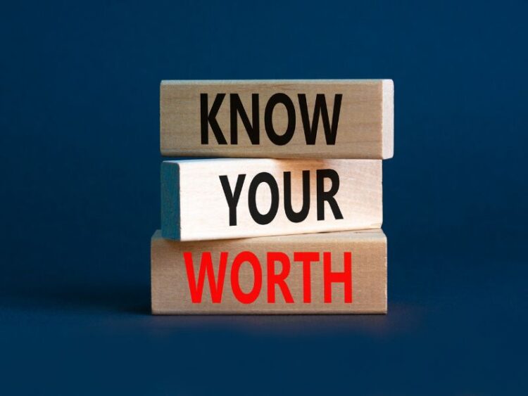 Wooden blocks with the words “Know Your Worth,” representing empowerment and self-value in mindful living.