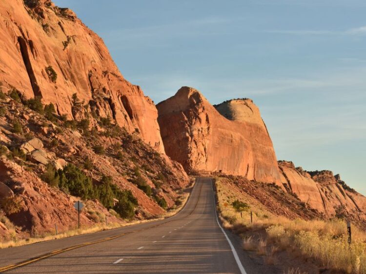 Open road through red rock desert leading to spa retreats