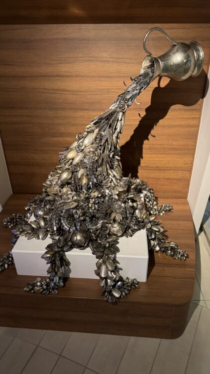 Unique cruise ship art sculpture of silver pitcher and flowers