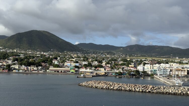 Scenic mindful travel view of Caribbean coastal town from cruise ship
