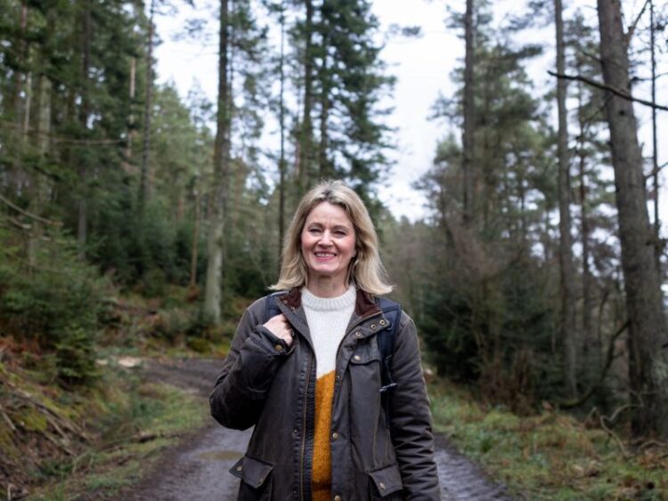 Balanced living, woman enjoying peaceful walk in nature trail