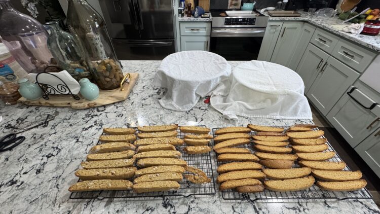 Cooling sourdough biscotti slices on baking sheet, showing mindful living through everyday baking rituals