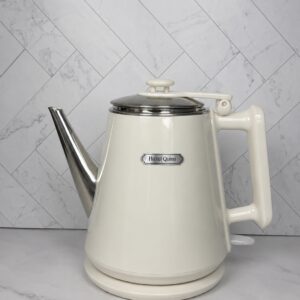 Hazel Quinn cream electric gooseneck kettle for pour-over coffee and tea on a marble countertop.