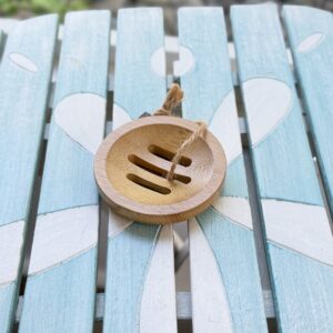 Eco-friendly bamboo shower steamer lift for improved drainage and longer-lasting shower steamers in the First Night Gift Collection.