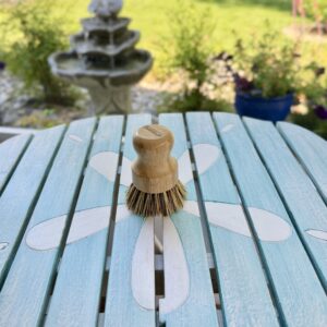 Eco-friendly bamboo pot scrubber with natural sisal and coconut bristles included in the First Night Gift Collection.