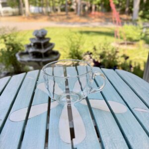 Set of two clear glass tea and coffee cups included in the First Night Gift Collection for housewarming and realtor gifts.