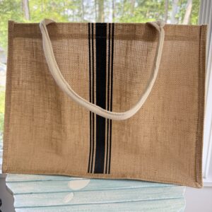 Natural jute tote bag with waterproof laminated lining used in the First Night Gift Collection for housewarming and realtor closing gifts.